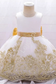 Biała sukienka dla dziewczynki z złotą cekinową kokardą
