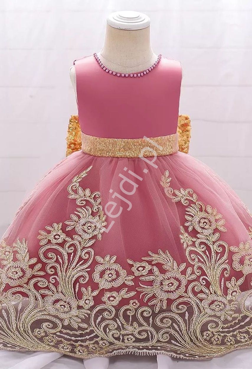 Fenomenalna sukienka dla dziewczynki w różowy kolorze złota kokardą