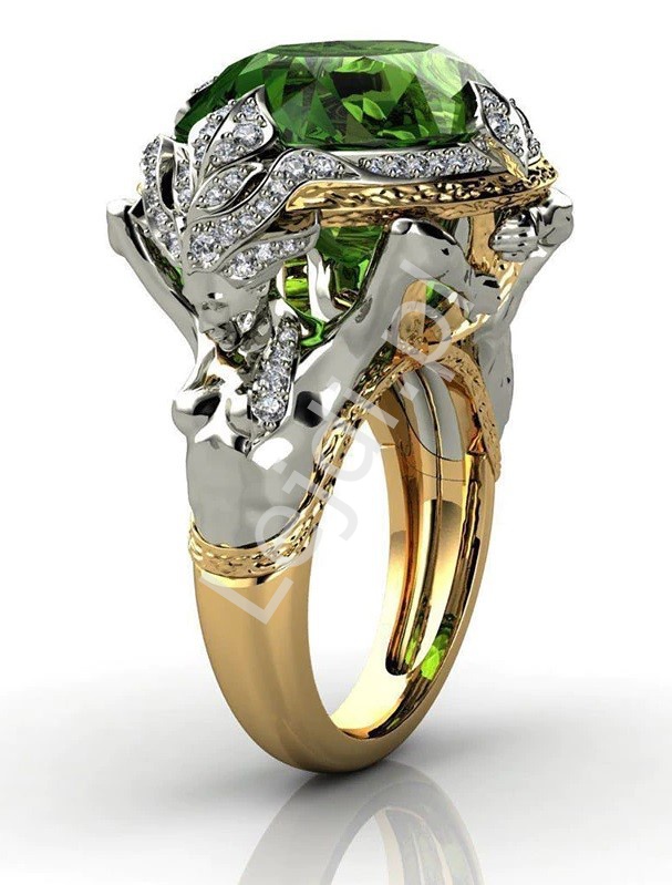 Oryginalny pierścionek z dużym zielony oczkiem 