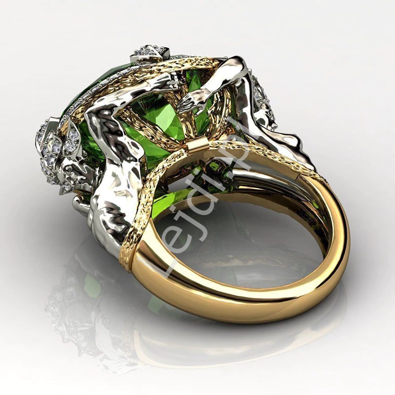 imponujący pierścionek z zielonym oczkiem,