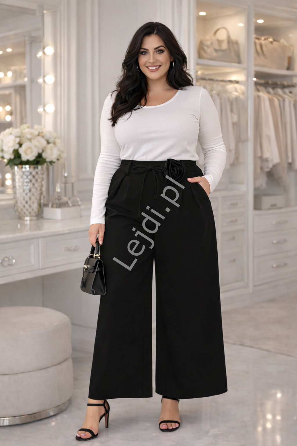 Spodnie PLUS SIZE czarne z zapliskami i kwiatem 25587